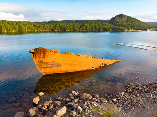 Rusty shipwreck near shore
