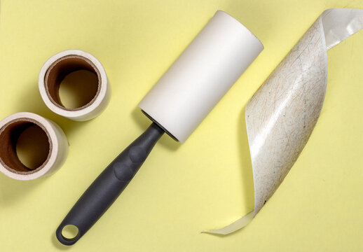 Sticky lint roller and cat hairs.