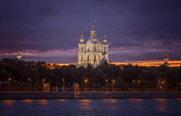 View of the Smolny Cathedral from the right bank of the Neva in St. Petersburg in the evening
