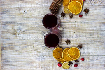 glasses with mulled wine on a wooden background. new year concept