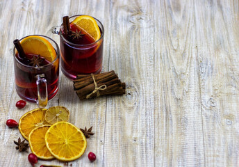 glasses with mulled wine on a wooden background. new year concept
