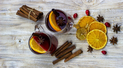glasses with mulled wine on a wooden background. new year concept