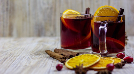 glasses with mulled wine on a wooden background. new year concept