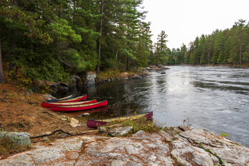 Canoes on the Madawaska River on a fall day in Eastern Ontario, Canada.