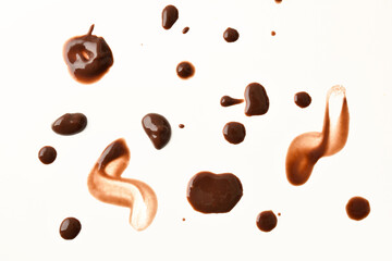 stains and drops of chocolates on white base