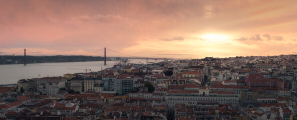 Lisbon bridge at sunset from a viewpoint