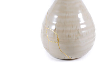 Antique Japanese Kintsugi, beige Kintsugi vase restored with gold cracks. Wabisabi pottery