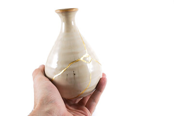 Antique Japanese Kintsugi, beige Kintsugi vase restored with gold cracks. Wabisabi pottery