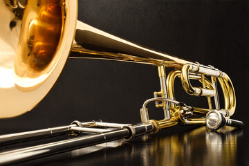 Trombone with transposer on a black table front view © Davizro Photography