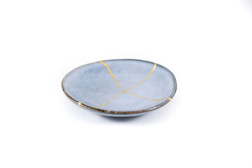Antique Japanese Kintsugi, light blue Kintsugi plate restored with gold cracks. Wabisabi pottery