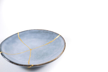 Antique Japanese Kintsugi, light blue Kintsugi plate restored with gold cracks. Wabisabi pottery