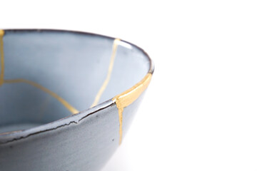 Antique Japanese Kintsugi, light blue Kintsugi bowl restored with gold cracks.
