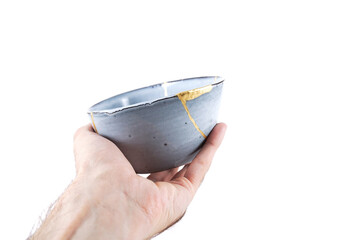 Antique Japanese Kintsugi, light blue Kintsugi bowl restored with gold cracks.