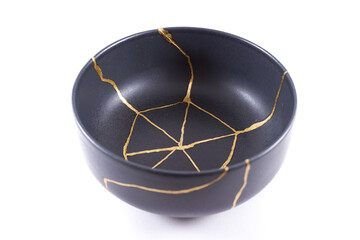 Antique Japanese Kintsugi, black Kintsugi bowl restored with gold cracks.
