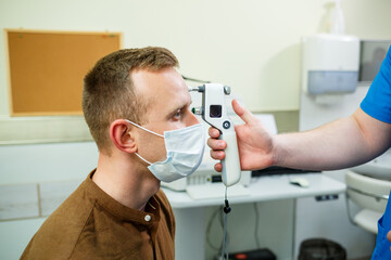 A patient in an ophthalmic hospital. Eye diagnostics in a modern hospital.