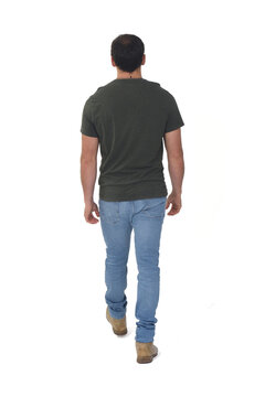 rear view of man walking on white background