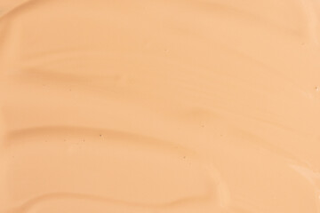 Makeup foundation background. Liquid foundation, concealer brush strokes and face powder. Makeup...