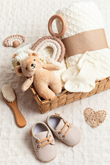 Collection of cute organic  baby clothes, shoes, toys and blanket. Heartwarming present for cold...