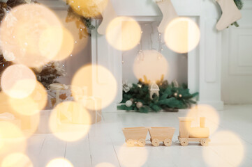 Christmas background with tree and balls, garland in defocus. New year card and copy space.