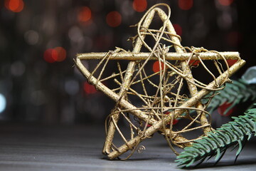 Christmas decoration with a decorative gold star, a sprig of a Christmas tree on the phone...