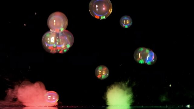 The beautiful flying of colorful soap bubbles. slow motion
