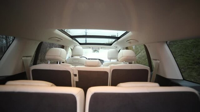 Electronic folding of the seats. folding the second and third row of seats in a premium car.