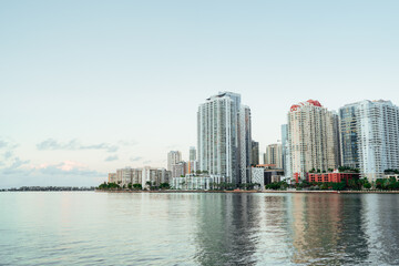 Fototapeta na wymiar Brickell skyline sea Miami Florida sunrise reflections buildings skyscrapers 