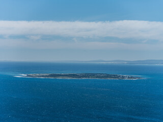 Aerial shot of robin island in the Atlantic ocean in Cape Town