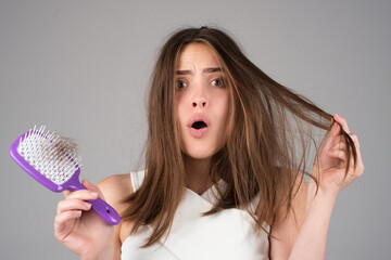 Stressed woman is very upset because of hair loss. Haircut and straightening hair care. Serious...
