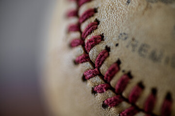 close-up of baseball and stitching artistic sports background