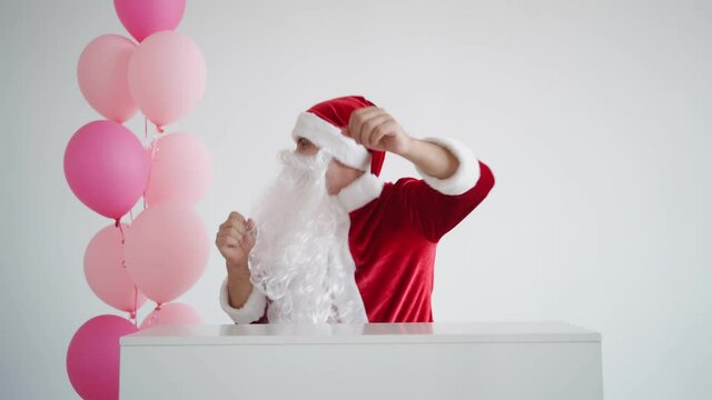 Santa Claus is dancing funny on a white background. Christmas and New Year 2022.