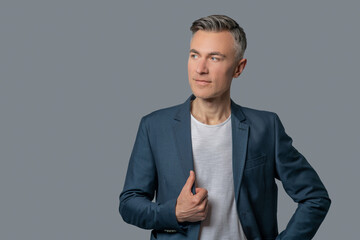 Calm elegant man on gray background