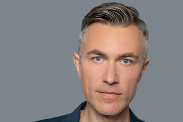 Fototapeta premium Face of attractive man with gray eyes