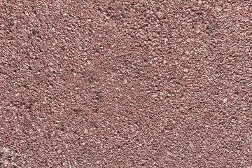 detailed over view of crushed red rock stone gravel walkway garden yard path