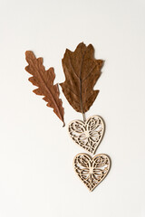 autumn oak leaves and fancy, laser cut wooden hearts - autumn love