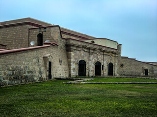 Fototapeta na wymiar Real Felipe Fortress is a military building built in the 18th century in the bay of Callao - Peru.