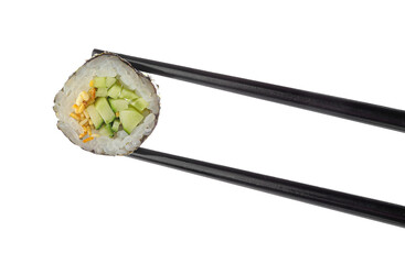 Chopsticks with delicious sushi roll on white background