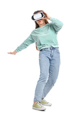 Beautiful young woman in VR glasses on white background