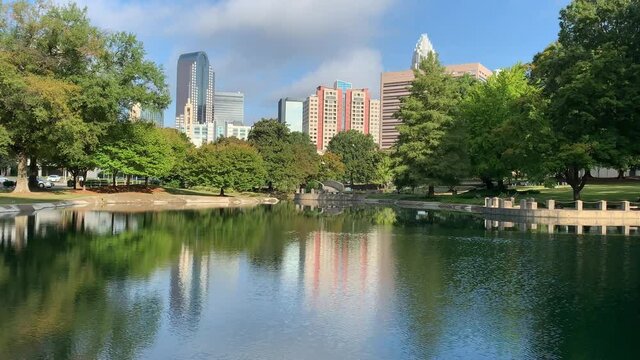 View of the uptown Charlotte NC skyline on an early fall day with reflections
