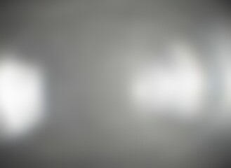 Glass transparent blur texture with lens flare effect. Polished surface. Grey background.