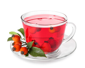 Glass cup of tasty rose hip tea and berries on white background