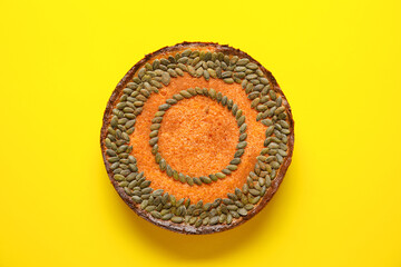 Delicious pumpkin pie on yellow background