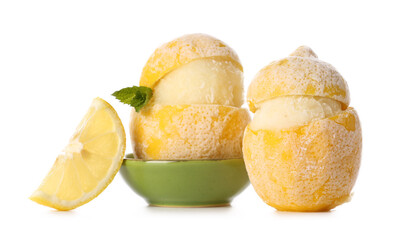 Tasty ice creams in lemon peels on white background