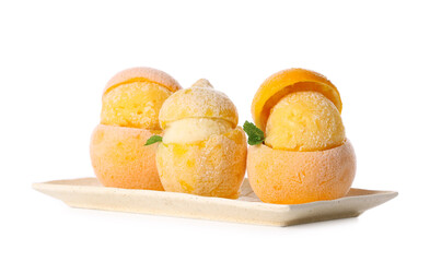 Plate with tasty ice creams in citrus fruit peels on white background