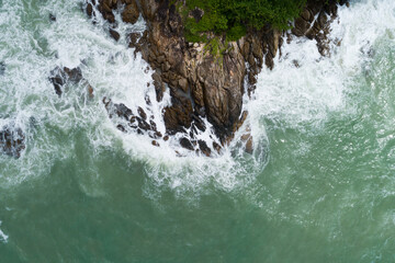 Aerial view of Amazing seashore at Phuket Thailand beautiful wave crashing on seacoast Top view sea in summer season Nature recovered Environment and Travel background