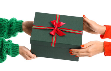 Hands with Christmas gift on white background