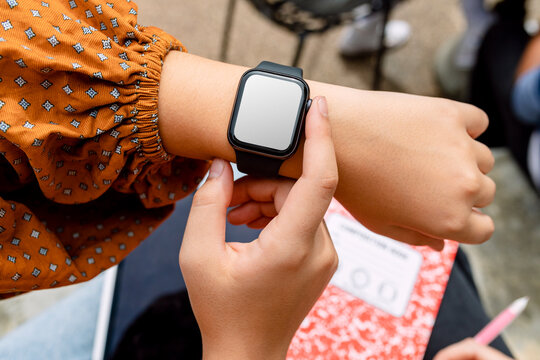 Smartwatch on female student&#39;s wrist