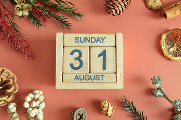 August 31, Cover design with calendar cube, pine cones and dried fruit in the natural concept.