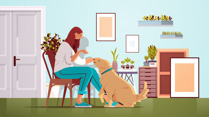 young woman spending time with dog female owner and cute domestic animal friendship with pet concept