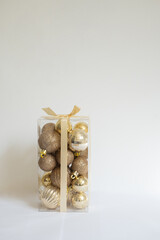 Vertical close-up of Christmas ball box with white background and copy space.